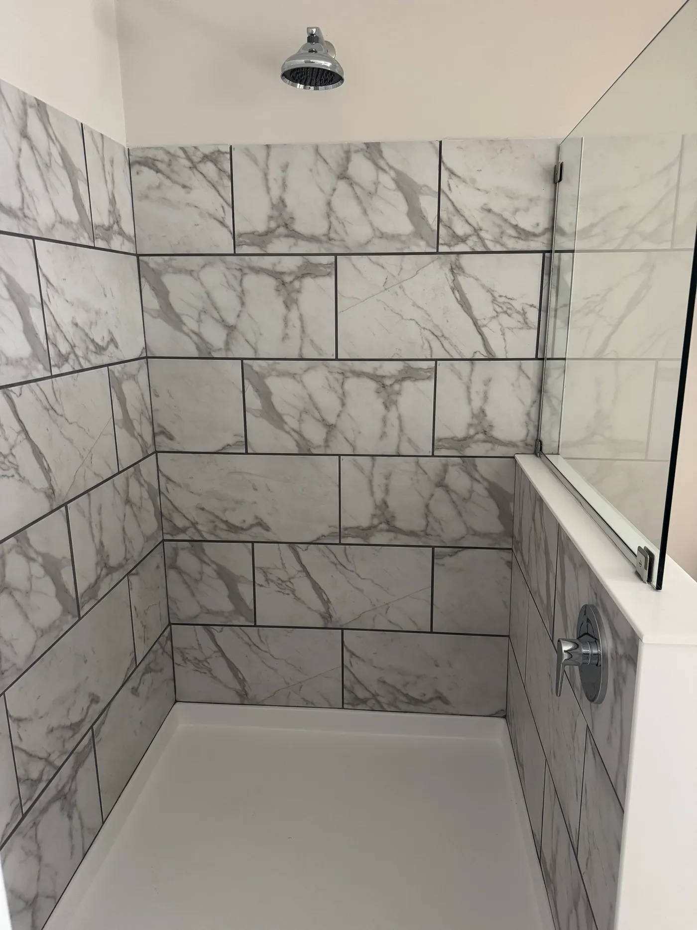 6 ft tile shower and rainfall showerhead. 