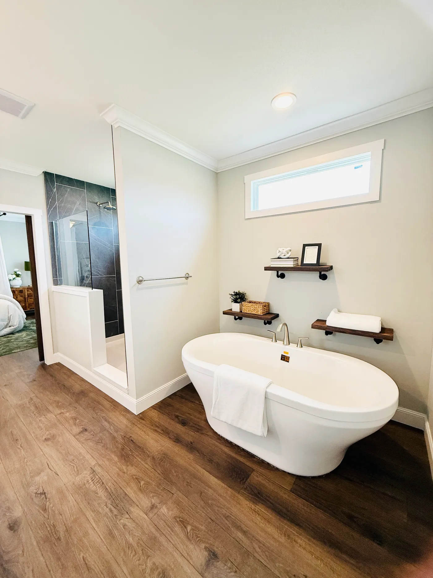 This beautiful freestanding soaking tub creates the perfect place to relax and unwind after a long day. The modern design and peaceful setting give the bathroom a luxury spa-like feel.