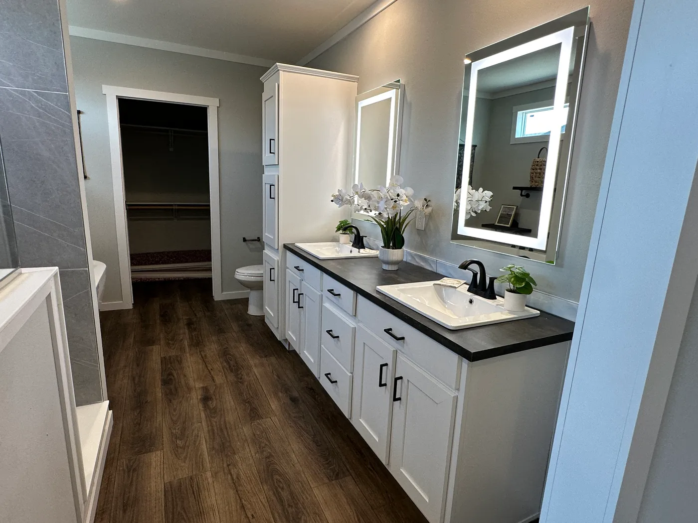 Step inside one of the most beautiful 4 bedroom, 3 bathroom tape and textured doublewide manufactured homes on the market. This stunning home is designed with upscale finishes, open living space, and modern comfort throughout. The spacious living room features vaulted ceilings, elegant crown moulding, and a built-in fireplace that creates a warm, high-end feel the moment you walk in.

The kitchen is loaded with premium features, including quartz countertops, stainless steel appliances, and a s