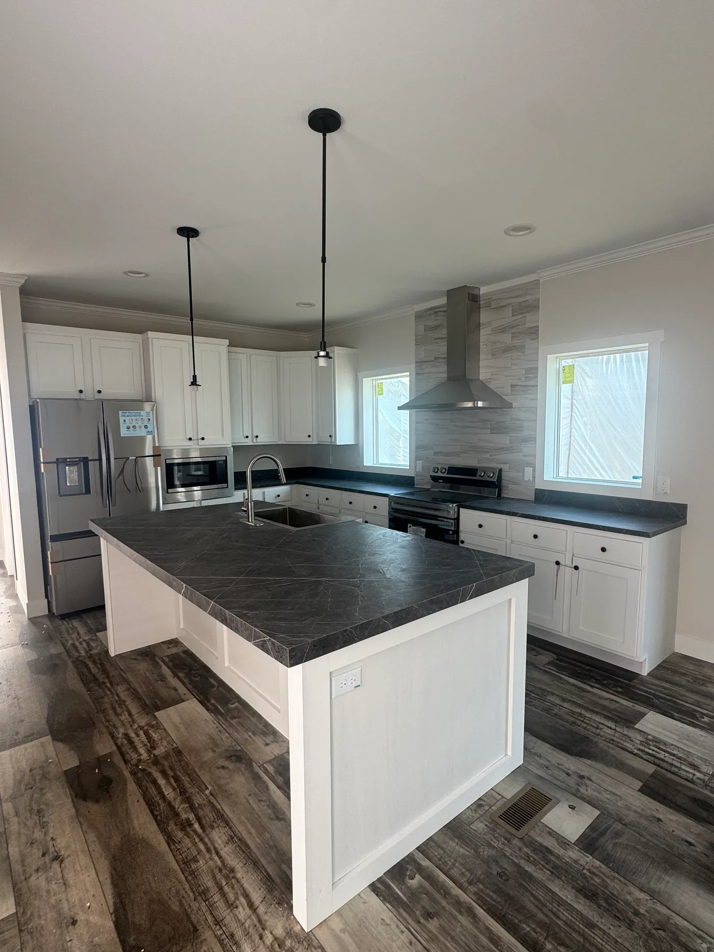 Glamour Kitchen, French door refrigerator, built in microwave, kitchen island to fit four barstools. 