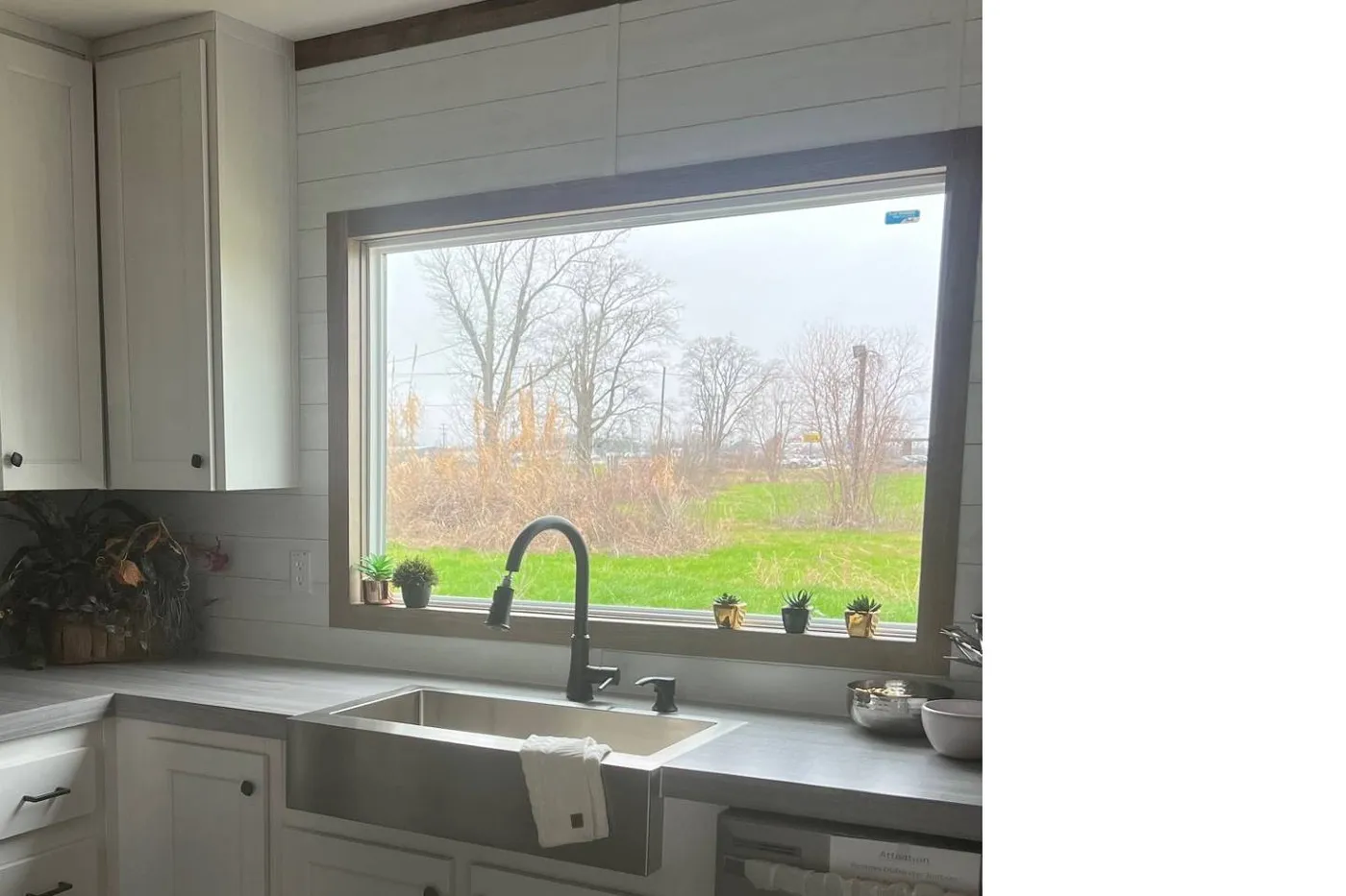 Farm House Sink 42 inch cabinets and extra Large Kitchen window to enjoy the view!