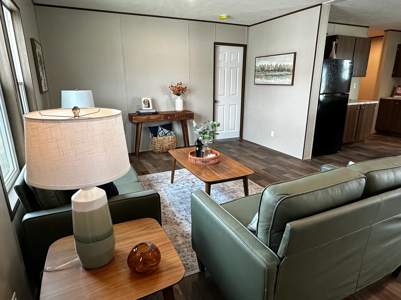 Discover the most affordable and spacious 4 bedroom, 2 bath doublewide manufactured home on the market! This budget-friendly mobile home features elevated ceilings, an open-concept layout, and plenty of room to grow with both a living room and separate den—perfect for entertaining, relaxing, or family space. The modern kitchen includes a large center island with ample storage and workspace. The private primary suite offers a walk-in closet, plus a luxury separate soaking tub and walk-in shower f