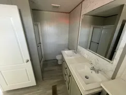 Double vanities and shower in primary bathroom