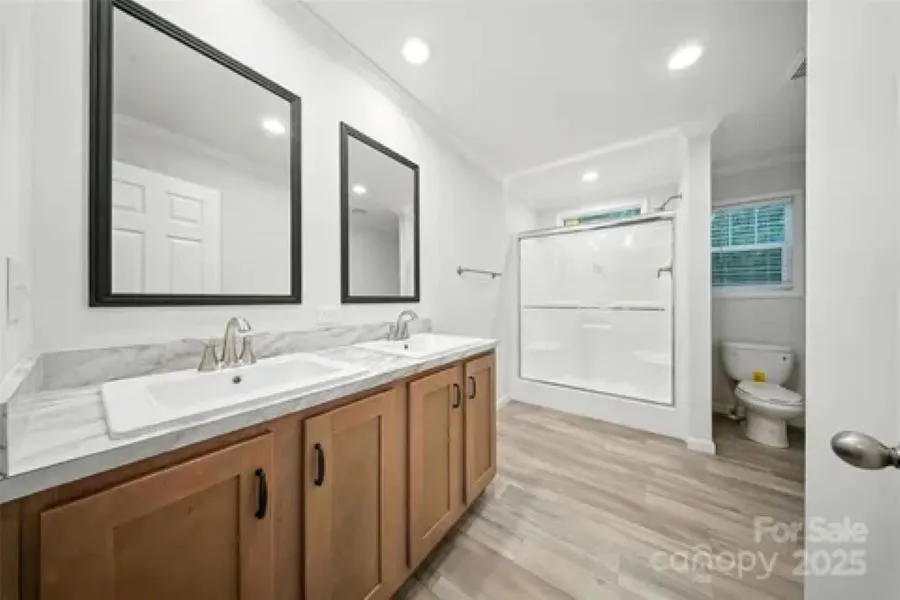 Primary bath with dual vanities.