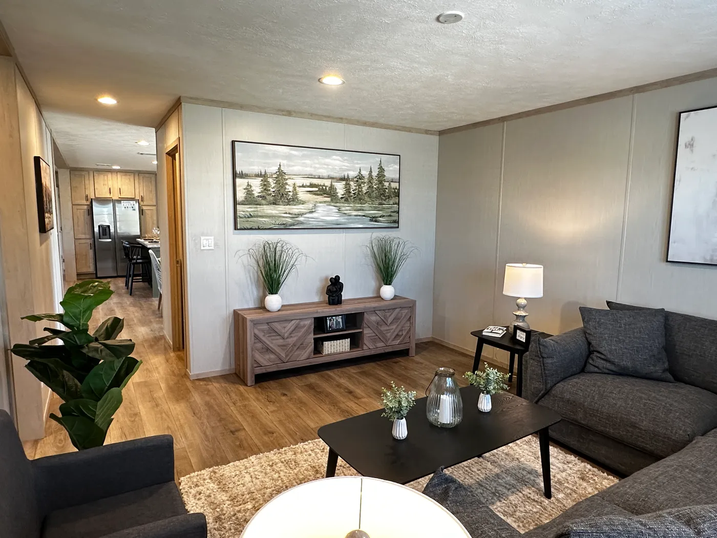 Spacious 3 bedroom, 2 bathroom double wide manufactured home built for comfort and family living. This open layout features both a living room and separate den, perfect for movie nights, entertaining, or creating private space for kids and adults. The modern kitchen includes stainless steel appliances and ample cabinet space. Enjoy year-round comfort with energy-efficient upflow ceiling vents for improved airflow. The private primary suite offers a relaxing retreat with a large soaking tub and s