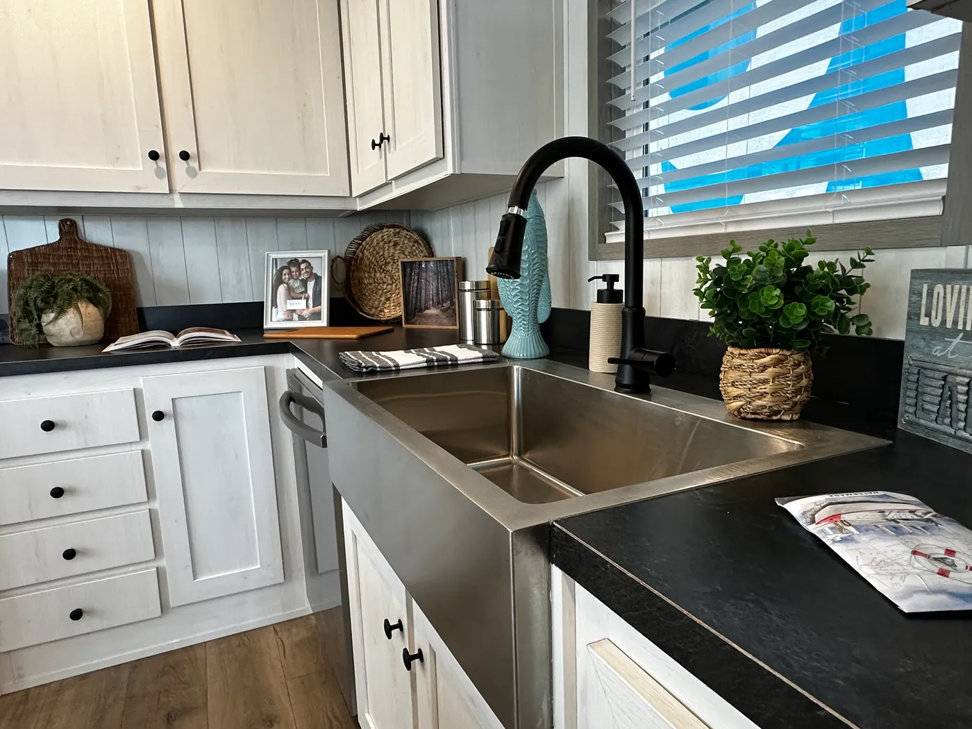 Discover this luxury porch model manufactured home featuring 2 bedrooms, 2 bathrooms, and high-end finishes designed for comfort and style. This modern manufactured home offers an open floor plan, stainless steel appliances, and a huge kitchen island perfect for entertaining. The spacious suite includes a walk-in closet and a large tiled low-profile walk-in shower for a spa-like feel. Built for durability and long-term value, this home features SmartPanel siding with a 50-year warranty, a 25-yea