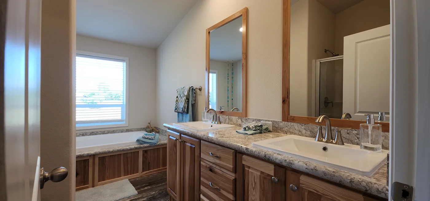 Glamour bathroom with tub, shower and dual sinks