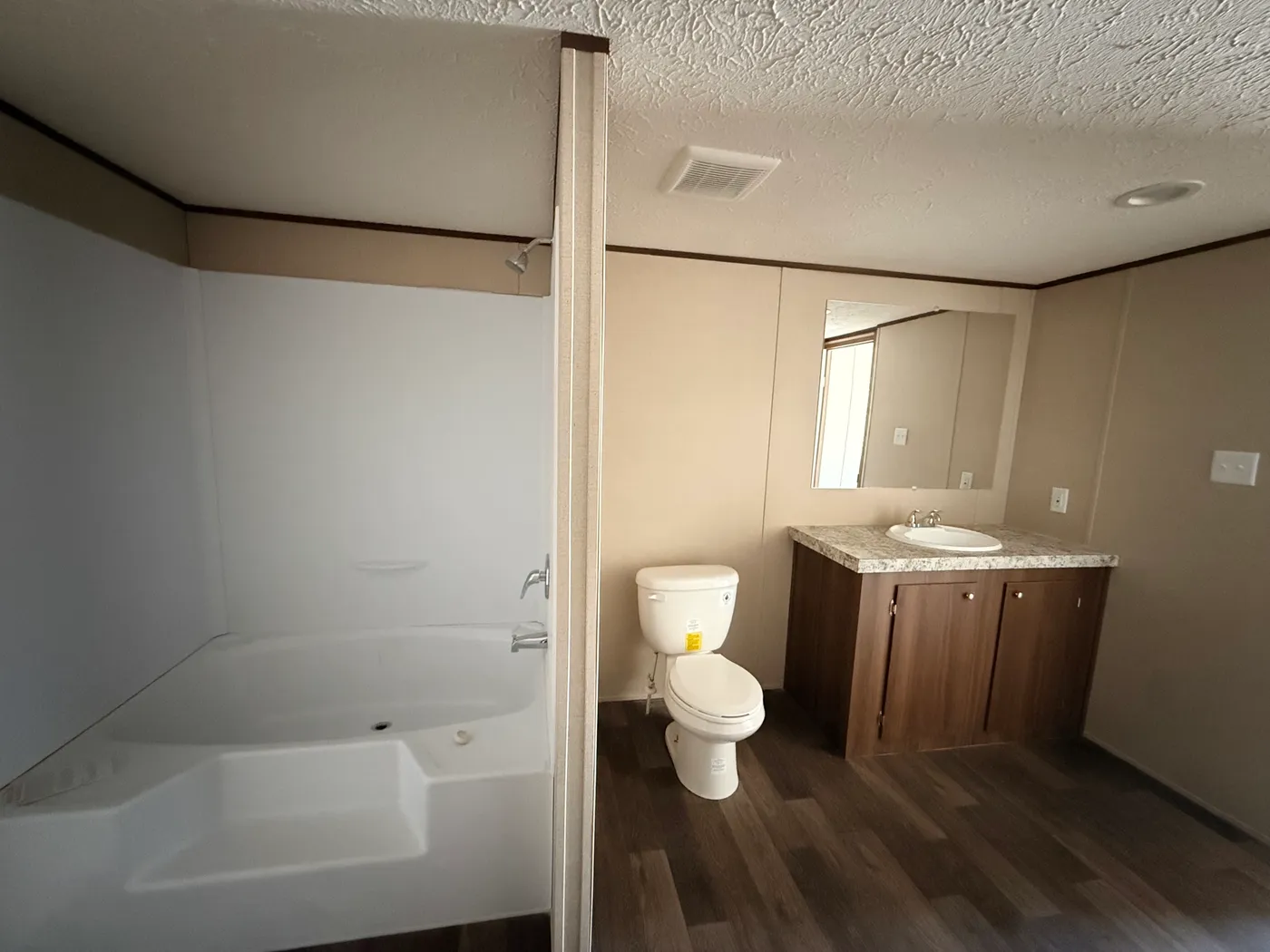 On suite full bathroom with shower and tub combo