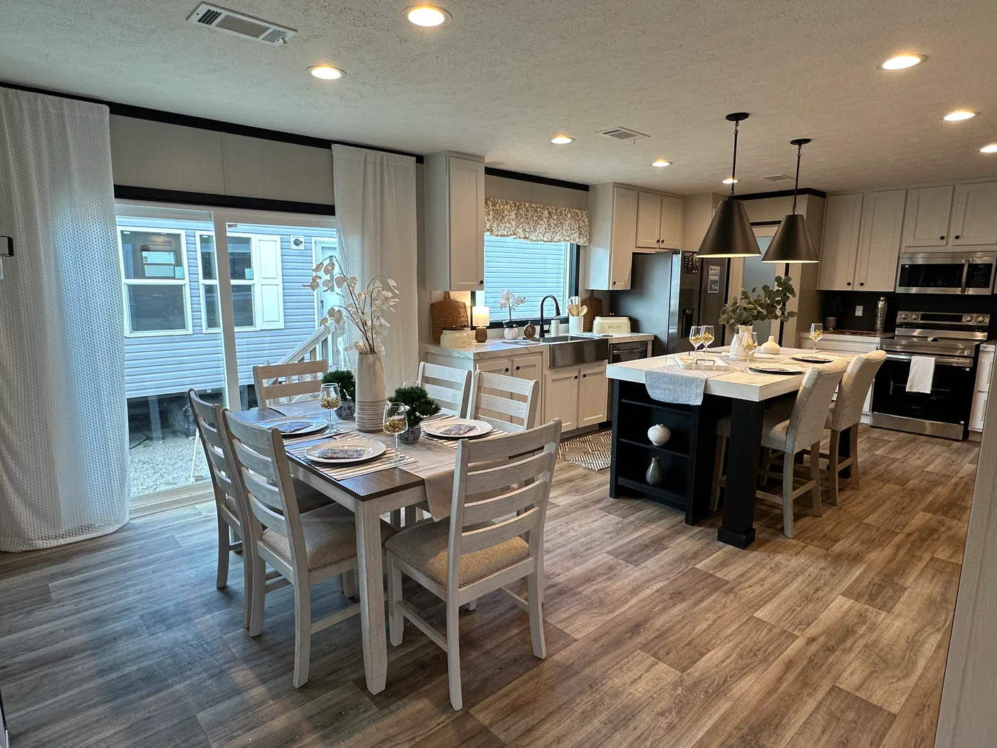 Discover The Heritage, a beautiful 3-bedroom, 2-bath manufactured home offering 1,568 square feet of spacious, functional living at Clayton Homes of Alvin, Texas! This stunning home features a spacious open-concept living room, a modern kitchen with an oversized multifunctional island, and a beautiful built-in fireplace. Enjoy a thoughtfully designed private split-bedroom floor plan, offering comfort and separation for the entire family. The oversized utility and laundry room features a convenie