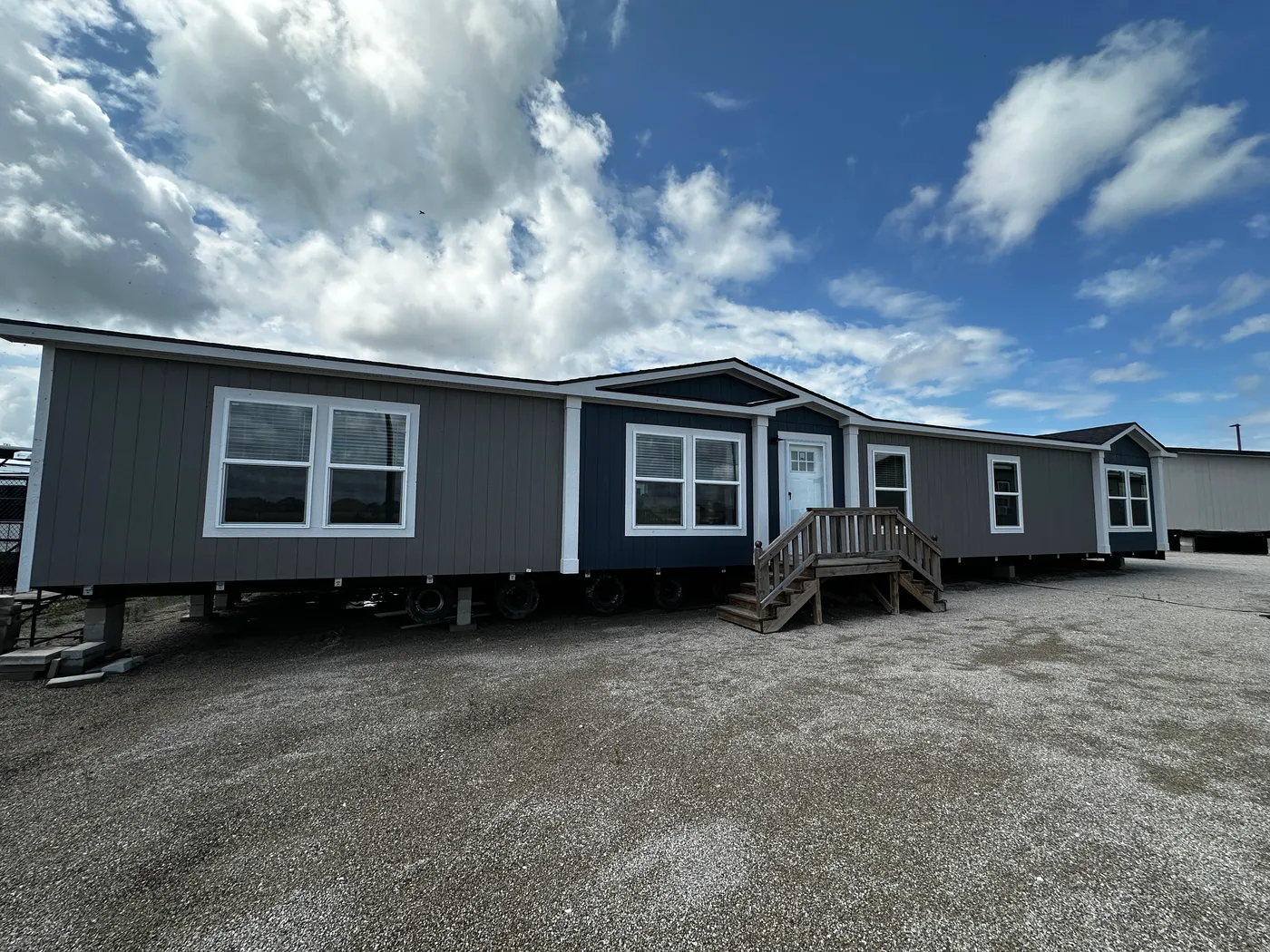 Spacious 4 bedroom 2 bath double wide manufactured home with massive square footage and modern design. Features an open floor plan with a large living room and separate den, perfect for entertaining or family living. The master suite offers a relaxing garden soaking tub, tiled-in walk-in shower, and plenty of space. Enjoy a cozy built-in fireplace, stylish finishes, and energy-efficient construction. This affordable mobile home is ideal for families seeking space, comfort, and value.