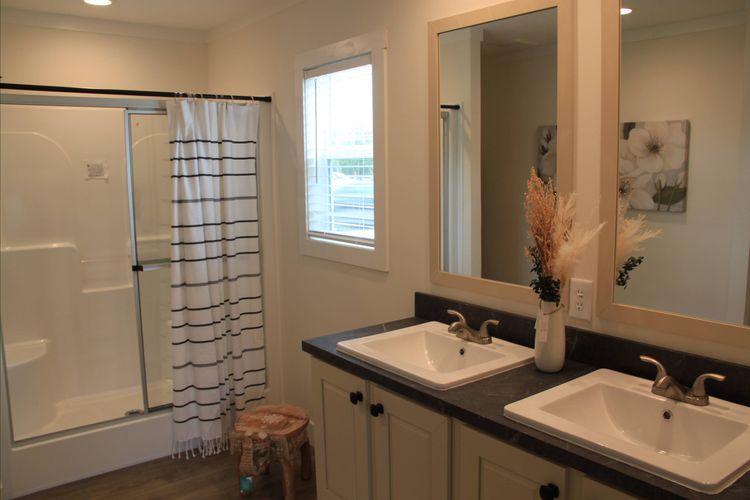 Double vanity bathroom with spacious shower