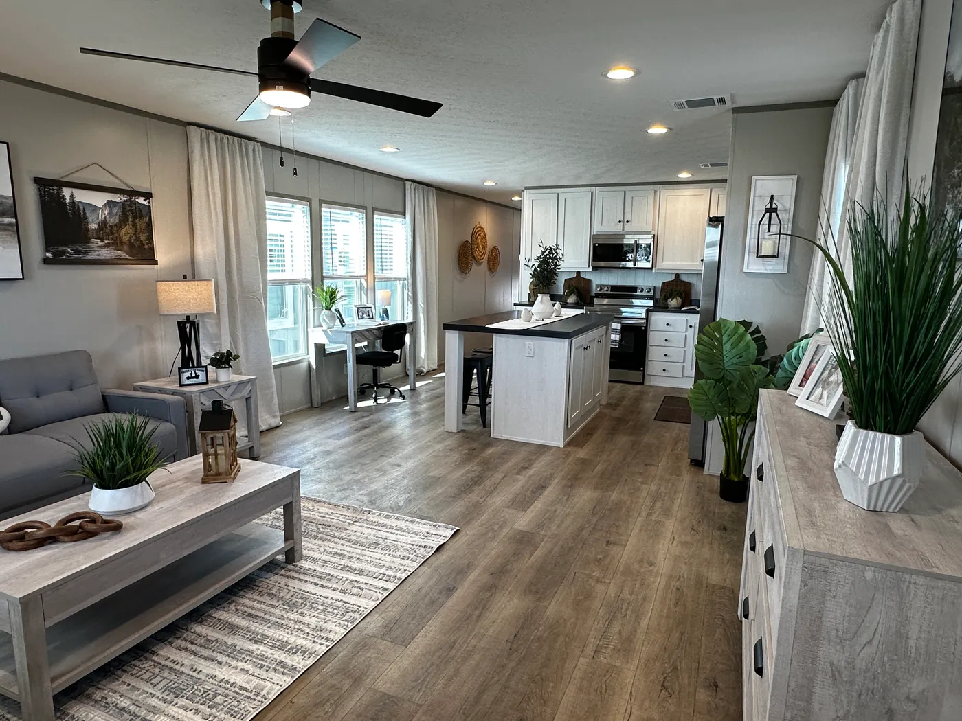 Discover this luxury porch model manufactured home featuring 2 bedrooms, 2 bathrooms, and high-end finishes designed for comfort and style. This modern manufactured home offers an open floor plan, stainless steel appliances, and a huge kitchen island perfect for entertaining. The spacious suite includes a walk-in closet and a large tiled low-profile walk-in shower for a spa-like feel. Built for durability and long-term value, this home features SmartPanel siding with a 50-year warranty, a 25-yea