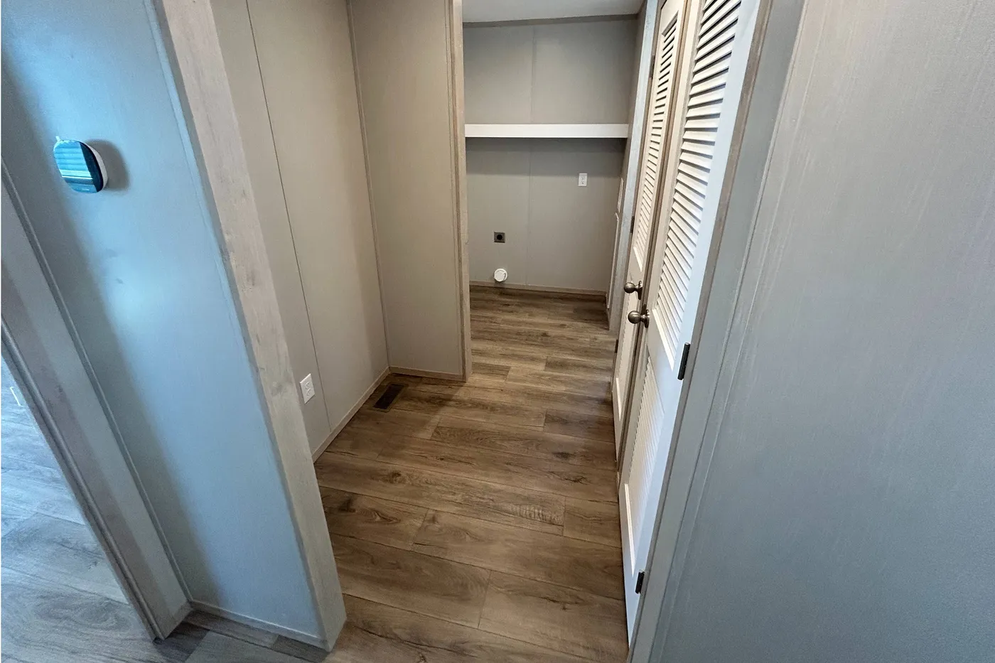 Looking into the utility room! Check out the Ecobee! 