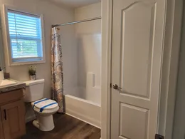 Tub/shower combo & linen closet in primary bathroom