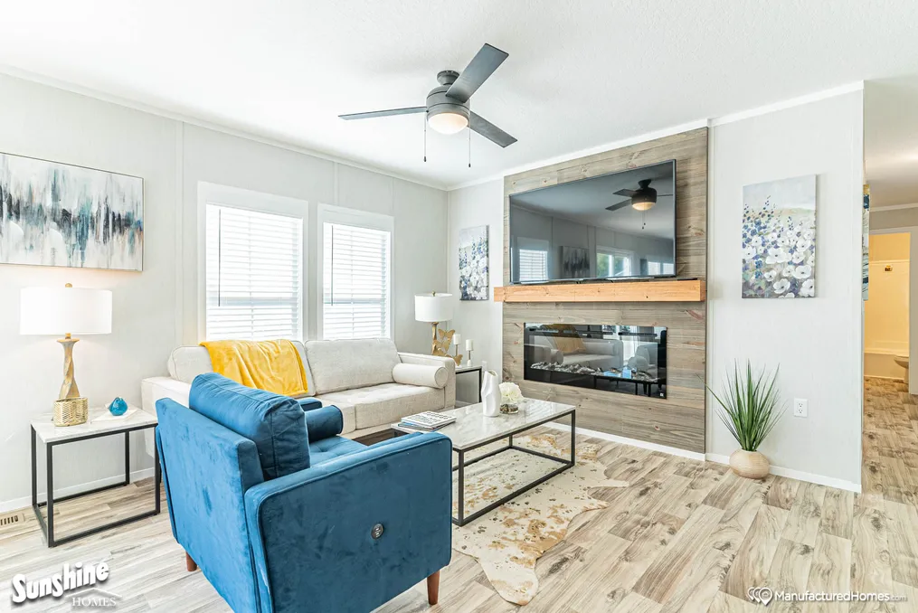 Electric fireplace, shiplap feature wall with TV ledge