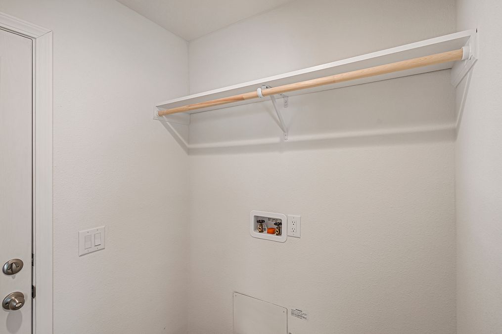 Utility room with storage shelf