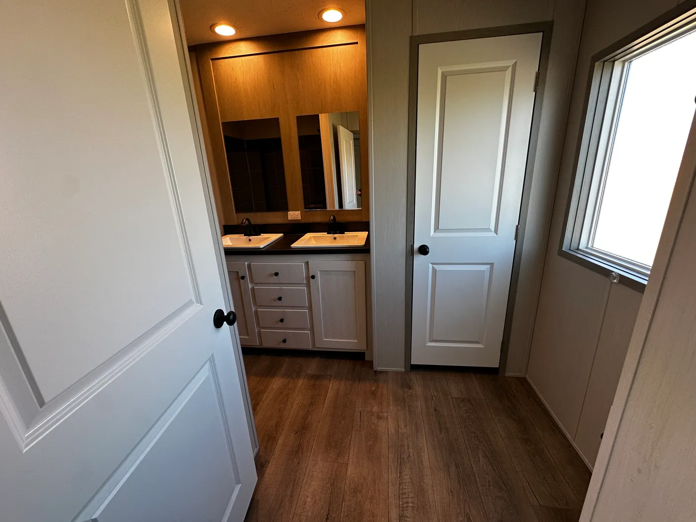 Discover this luxury porch model manufactured home featuring 2 bedrooms, 2 bathrooms, and high-end finishes designed for comfort and style. This modern manufactured home offers an open floor plan, stainless steel appliances, and a huge kitchen island perfect for entertaining. The spacious suite includes a walk-in closet and a large tiled low-profile walk-in shower for a spa-like feel. Built for durability and long-term value, this home features SmartPanel siding with a 50-year warranty, a 25-yea