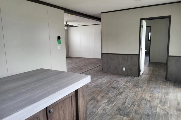 Kitchen leads into Living room