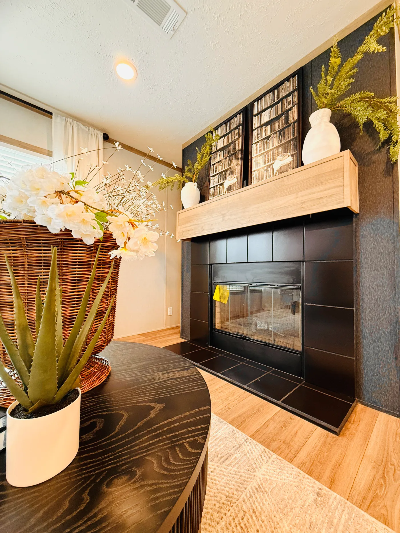 This beautiful built-in fireplace with a modern accent wall creates a warm and inviting focal point in the living space. It’s the perfect spot to relax on cool evenings, enjoy a movie night, or gather with family and friends.

The clean design and stylish finishes give the room a comfortable yet upscale feel.