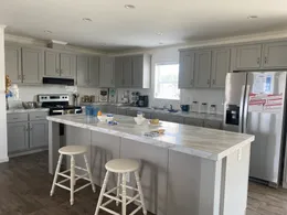 So much storage.  Beautiful light gray cabinets and stainless steel.  