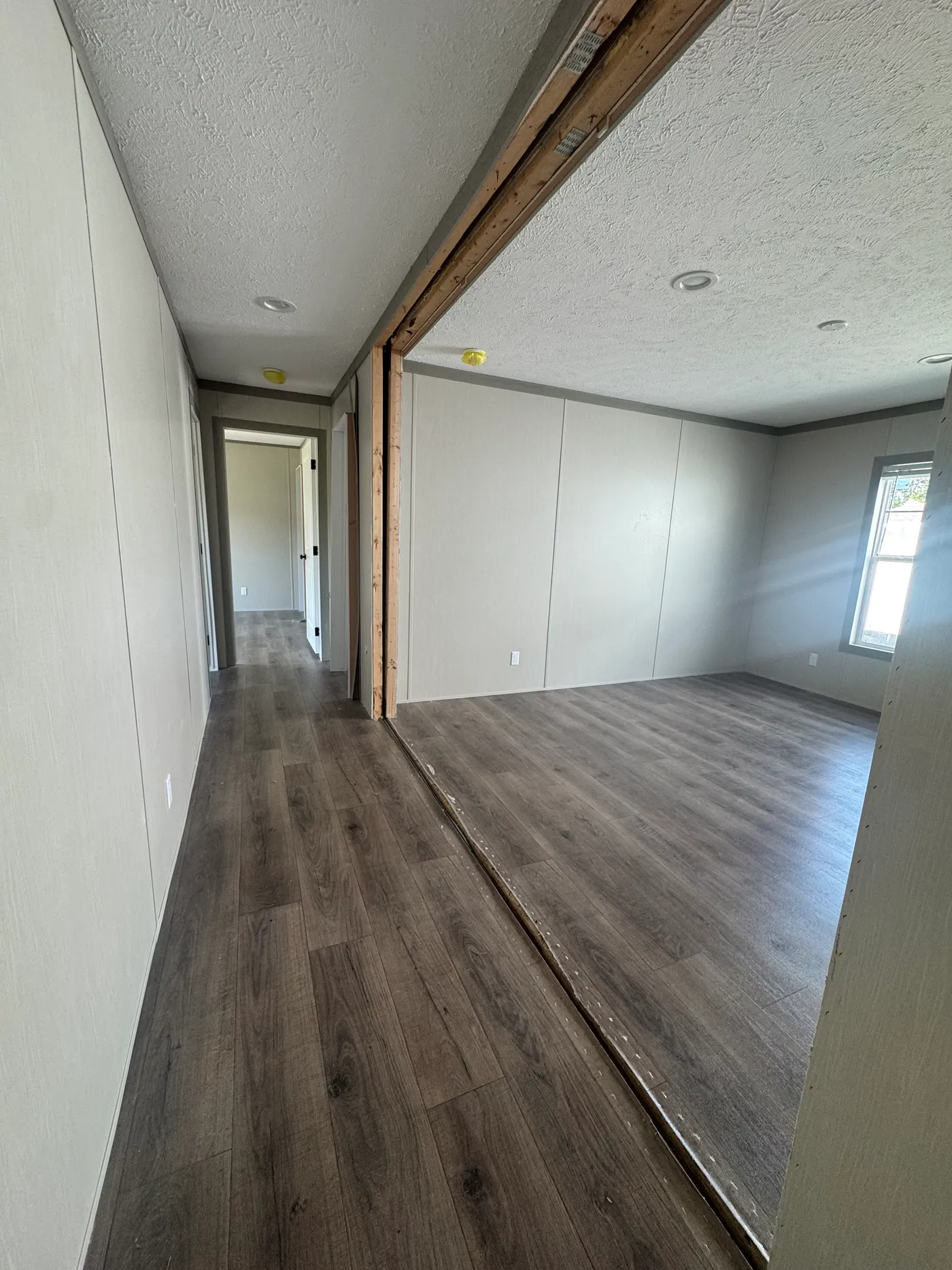 Hallway to spare bedrooms and den