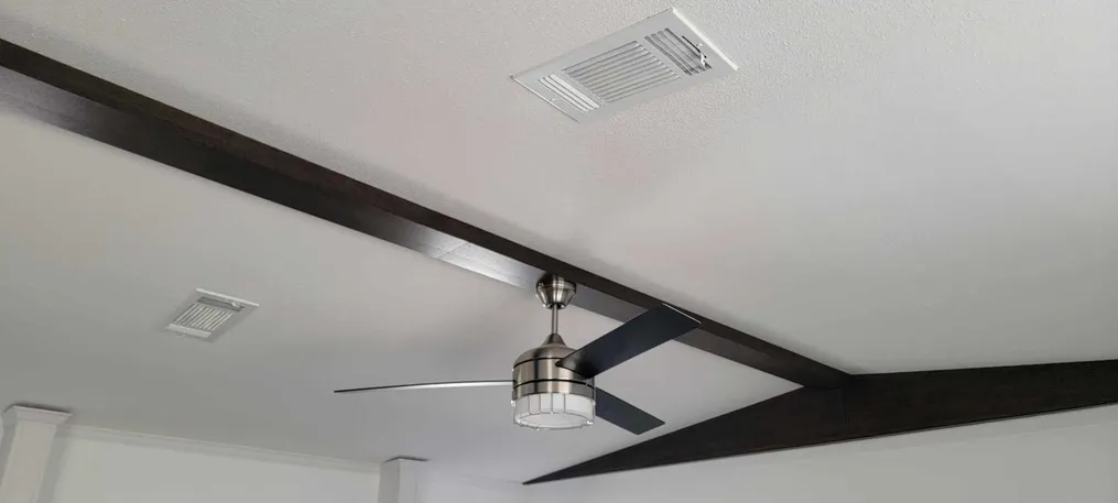 Ceiling vents & modern fan. Light ceiling texture
