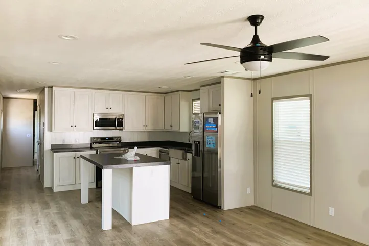 Open Floor plan with Island and Stainless Steel Appliances 