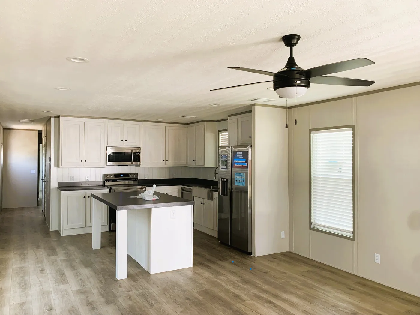 Open Floor plan with Island and Stainless Steel Appliances 