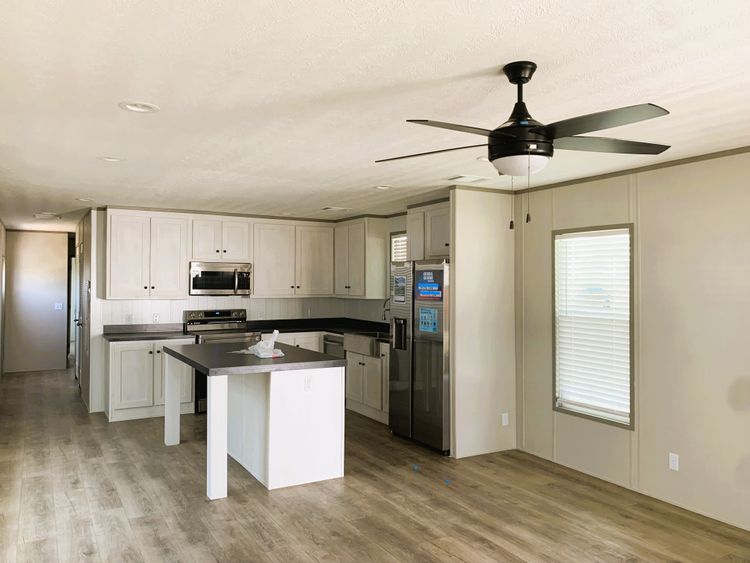 Open Floor plan with Island and Stainless Steel Appliances 