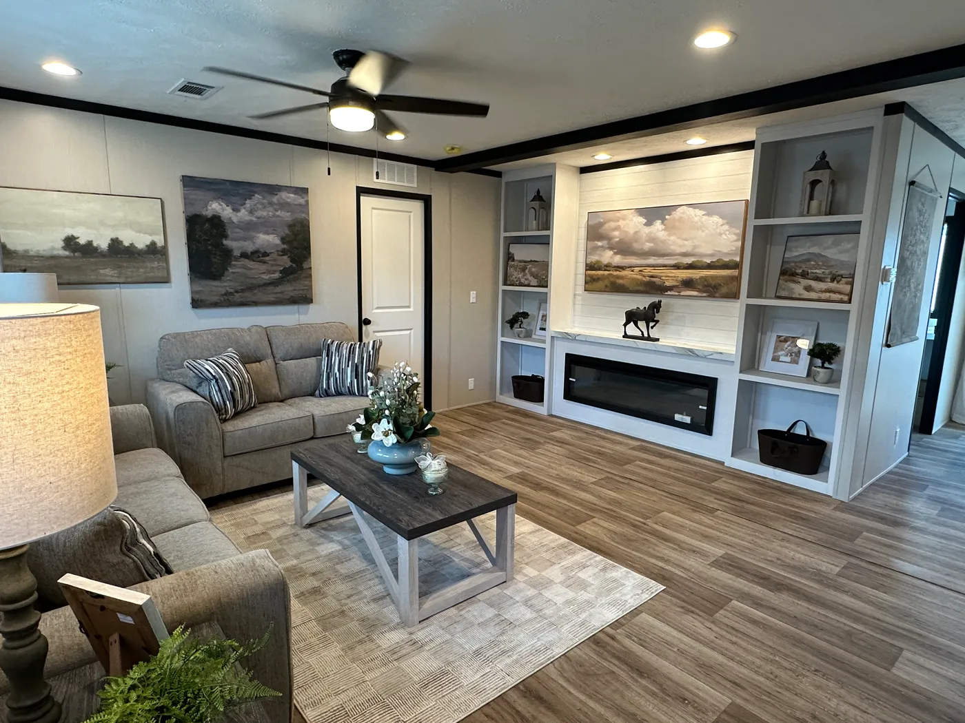 Discover The Heritage, a beautiful 3-bedroom, 2-bath manufactured home offering 1,568 square feet of spacious, functional living at Clayton Homes of Alvin, Texas! This stunning home features a spacious open-concept living room, a modern kitchen with an oversized multifunctional island, and a beautiful built-in fireplace. Enjoy a thoughtfully designed private split-bedroom floor plan, offering comfort and separation for the entire family. The oversized utility and laundry room features a convenie