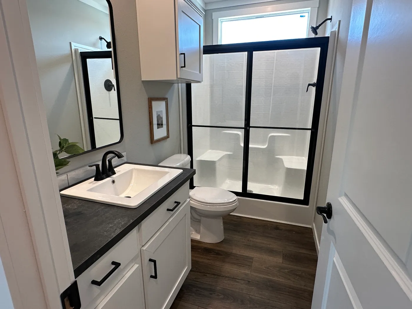 Step inside one of the most beautiful 4 bedroom, 3 bathroom tape and textured doublewide manufactured homes on the market. This stunning home is designed with upscale finishes, open living space, and modern comfort throughout. The spacious living room features vaulted ceilings, elegant crown moulding, and a built-in fireplace that creates a warm, high-end feel the moment you walk in.

The kitchen is loaded with premium features, including quartz countertops, stainless steel appliances, and a s