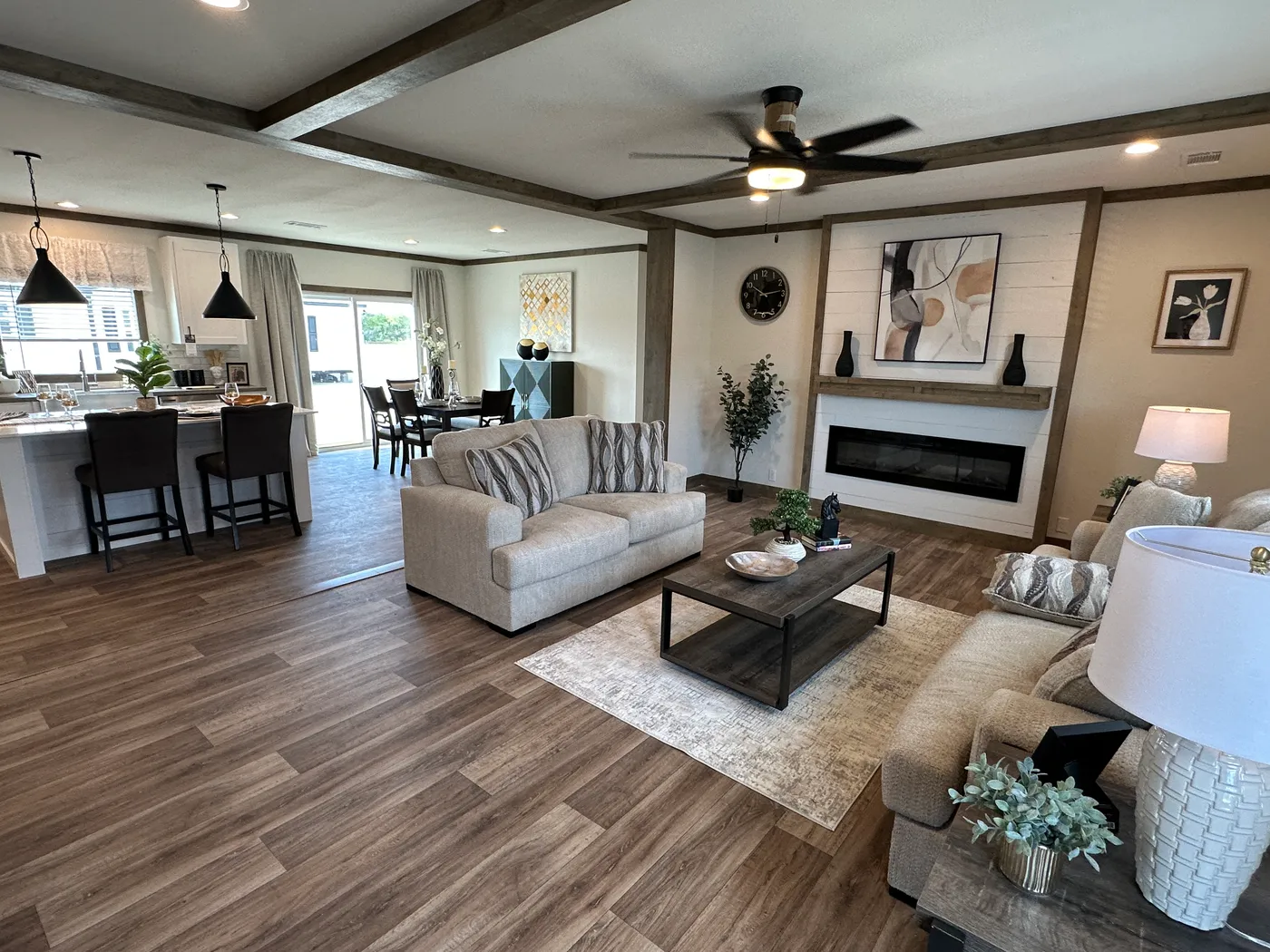 Discover The Summit, a stunning luxury doublewide manufactured home at Clayton Homes of Alvin, Texas! Designed for modern living, this beautiful home features a spacious open-concept floor plan, elegant interior finishes, and an impressive gourmet kitchen with a massive center island, stainless steel appliances, and abundant cabinet space. Enjoy generous living areas, spacious bedrooms, walk-in closets, and a luxurious primary suite designed for comfort and relaxation. Combining modern farmhouse
