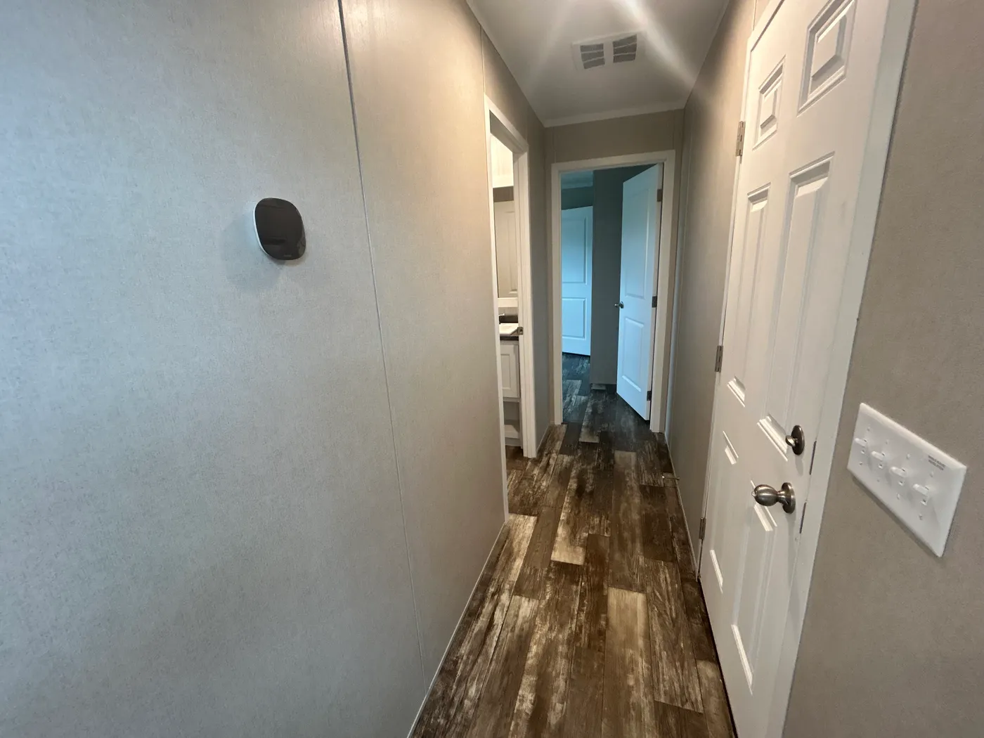 Looking down the hallway, featuring the Ecobee! 