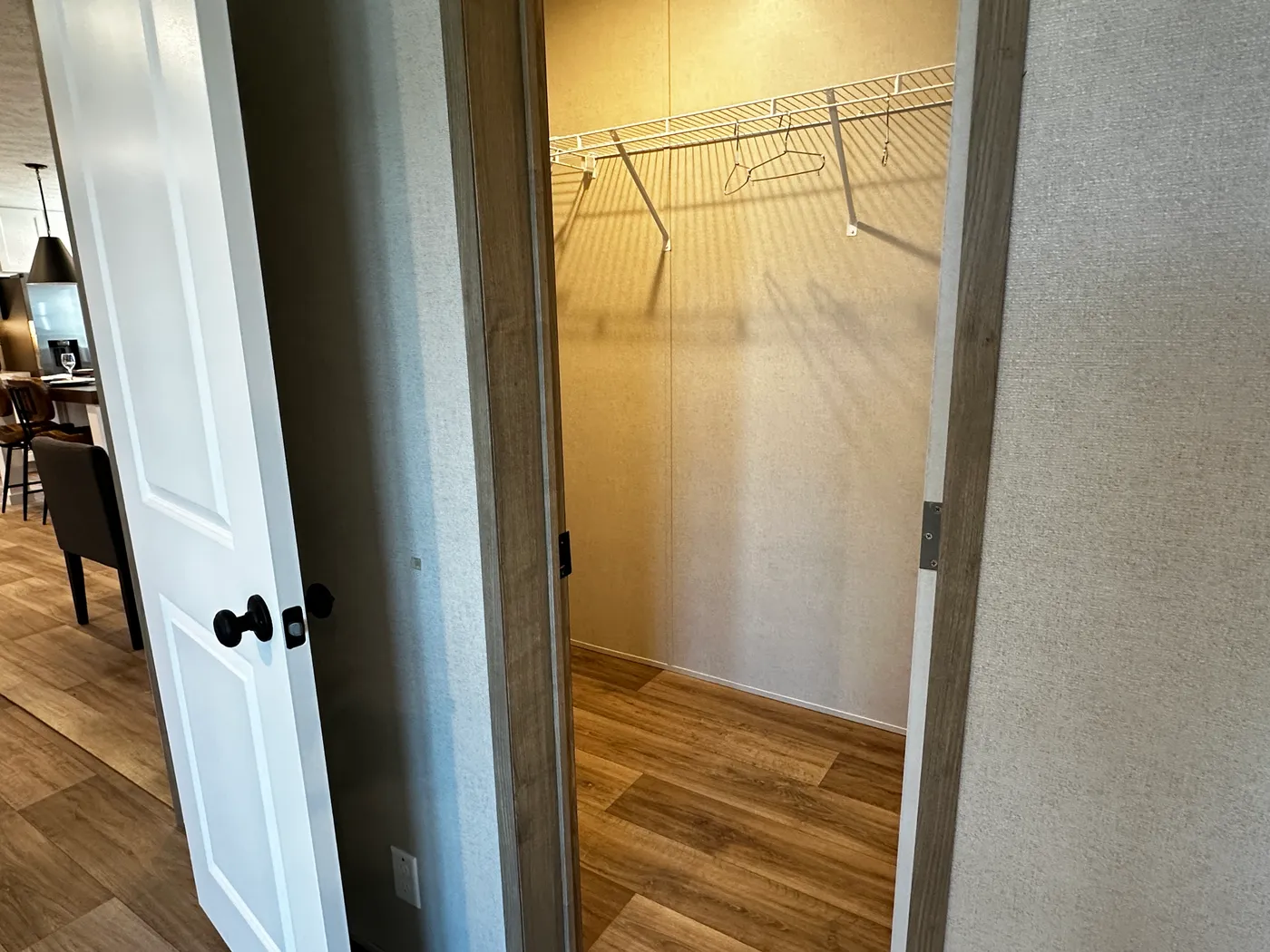 Modern luxury meets affordability in this 3 bedroom, 2 bathroom double wide manufactured home designed for comfort and style. The open-concept layout features a spacious living area with a gorgeous built-in entertainment center and plenty of natural light. The designer kitchen includes stainless steel appliances, a large kitchen island, and ample cabinet space, perfect for cooking and entertaining. Enjoy enhanced comfort with energy-efficient upflow ceiling vents for improved airflow throughout 