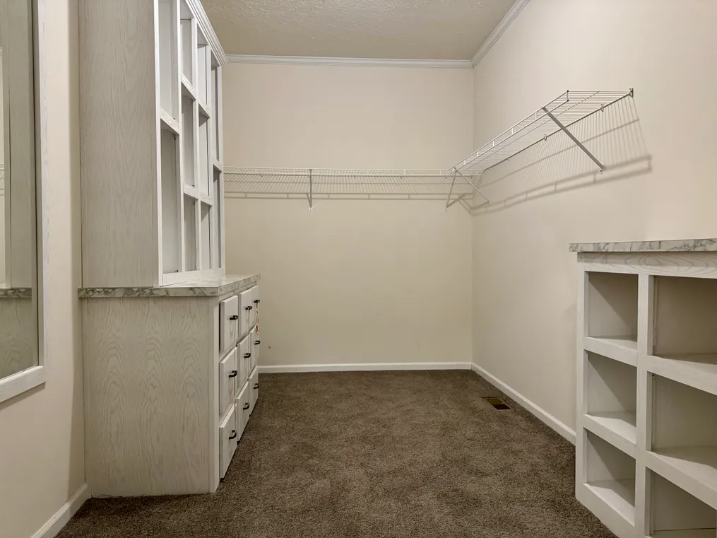 Oversized Primary Closet With Built Ins!