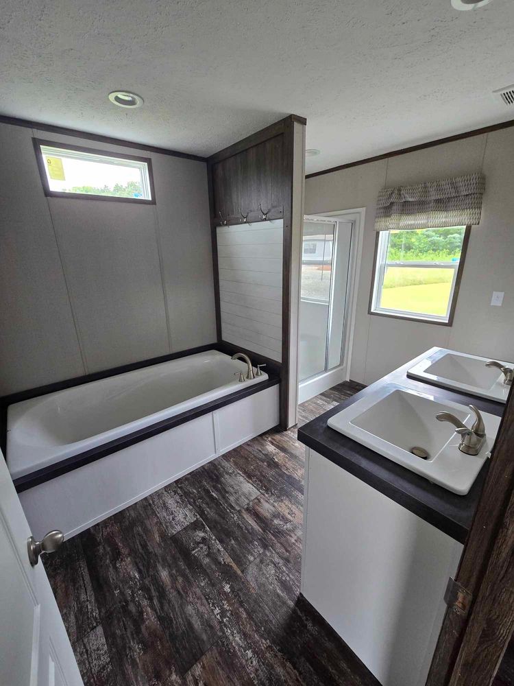 glamor tub, separate shower plus his & her sinks! 