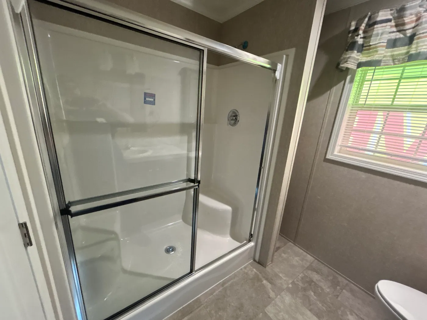 Glass shower featured inside the main bathroom. 