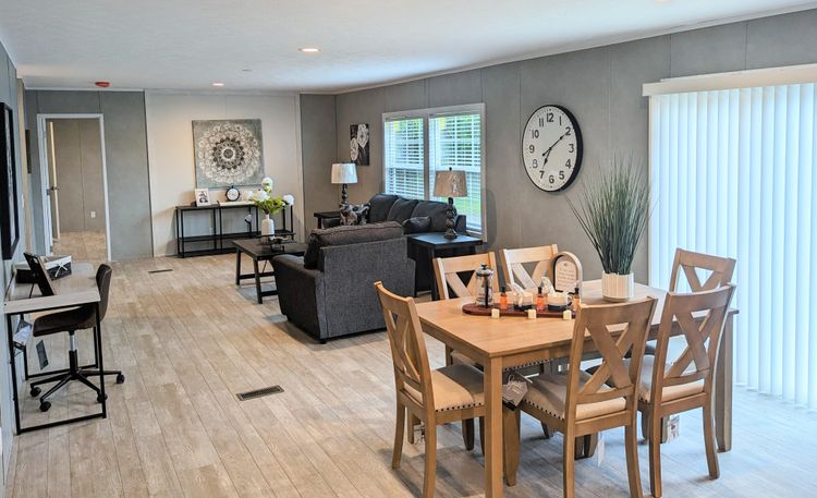 Check out this open floor plan! This beautiful dining room areas opens up to the second living room/family room. 