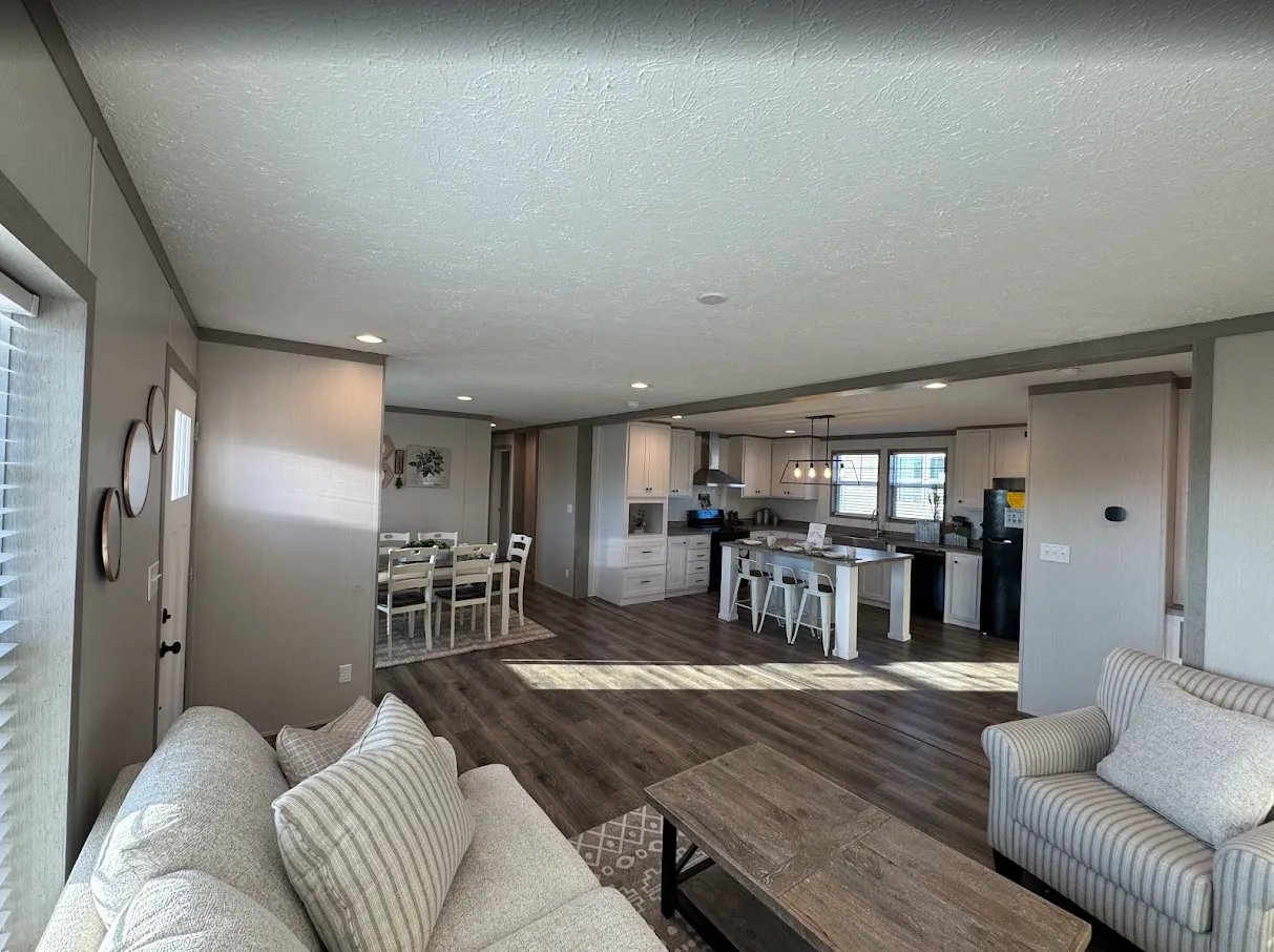 The view of the dining and kitchen area from the living area