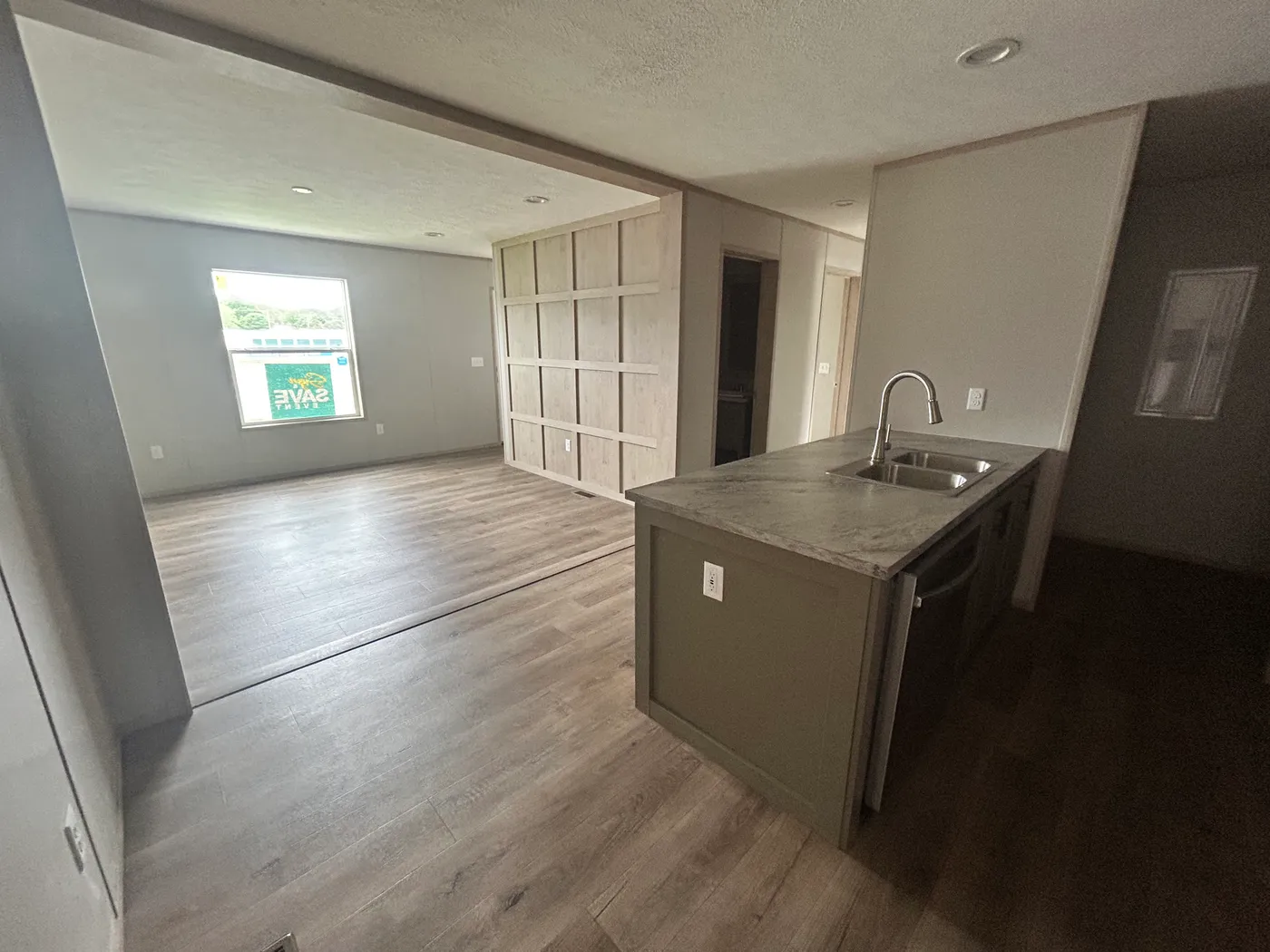 Full view of living room and kitchen area. 