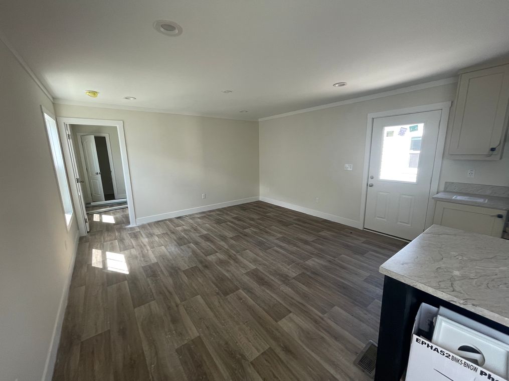Open concept living room with finished drywall 