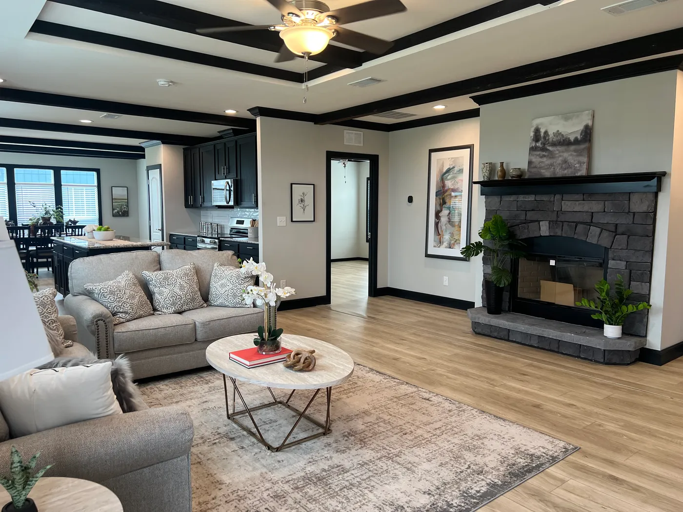 Beautiful tape and texture manufactured home living room with 9 foot tray ceiling . Best deals and prices on affordable, quality, Clayton Built manufactured home in texas.