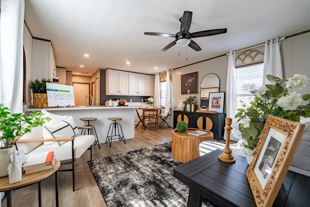 Beautiful manufactured tiny home living room and kitchen. Best deals and prices on Clayton Built manufactured home in texas.
