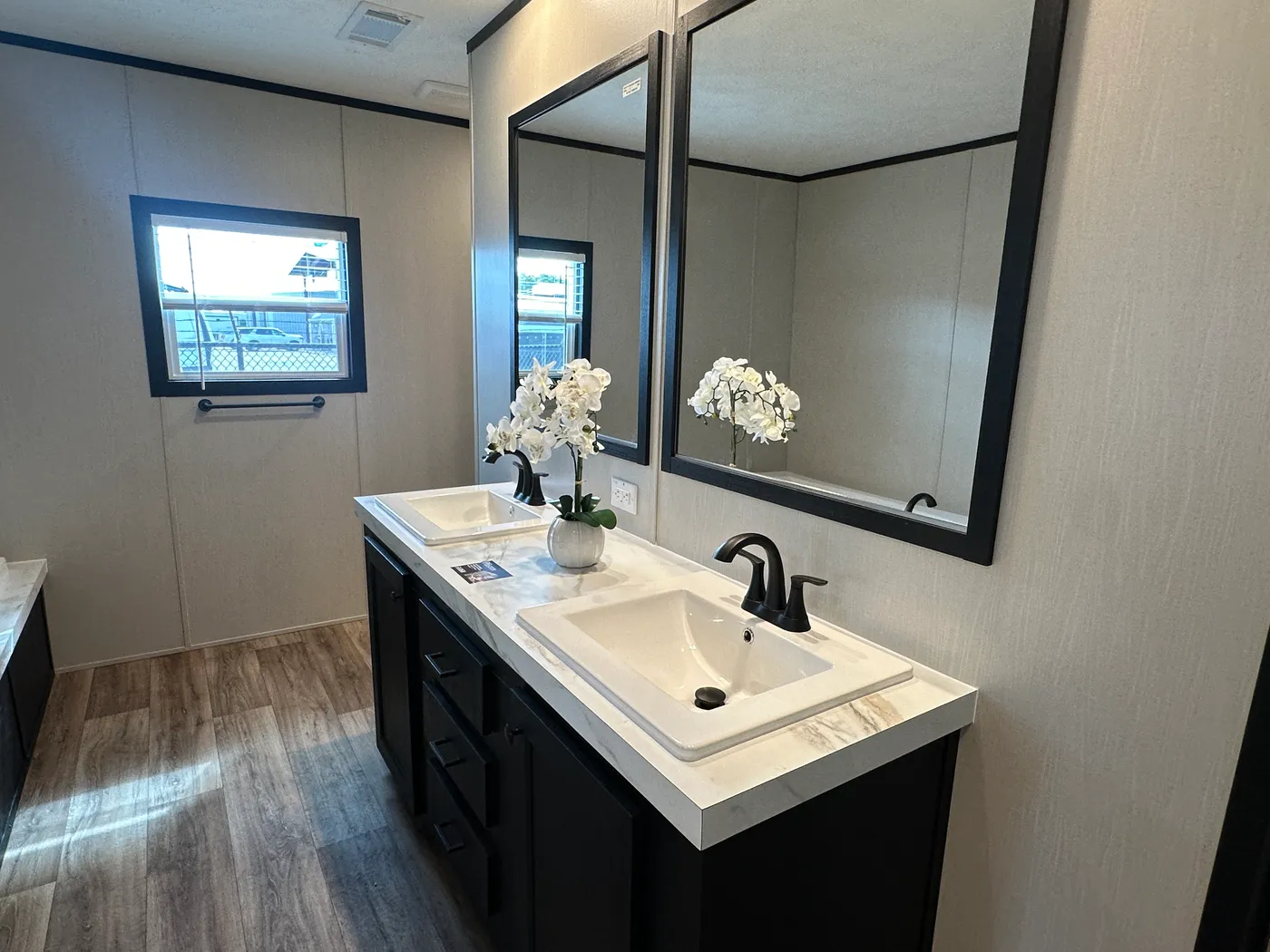 Discover The Heritage, a beautiful 3-bedroom, 2-bath manufactured home offering 1,568 square feet of spacious, functional living at Clayton Homes of Alvin, Texas! This stunning home features a spacious open-concept living room, a modern kitchen with an oversized multifunctional island, and a beautiful built-in fireplace. Enjoy a thoughtfully designed private split-bedroom floor plan, offering comfort and separation for the entire family. The oversized utility and laundry room features a convenie