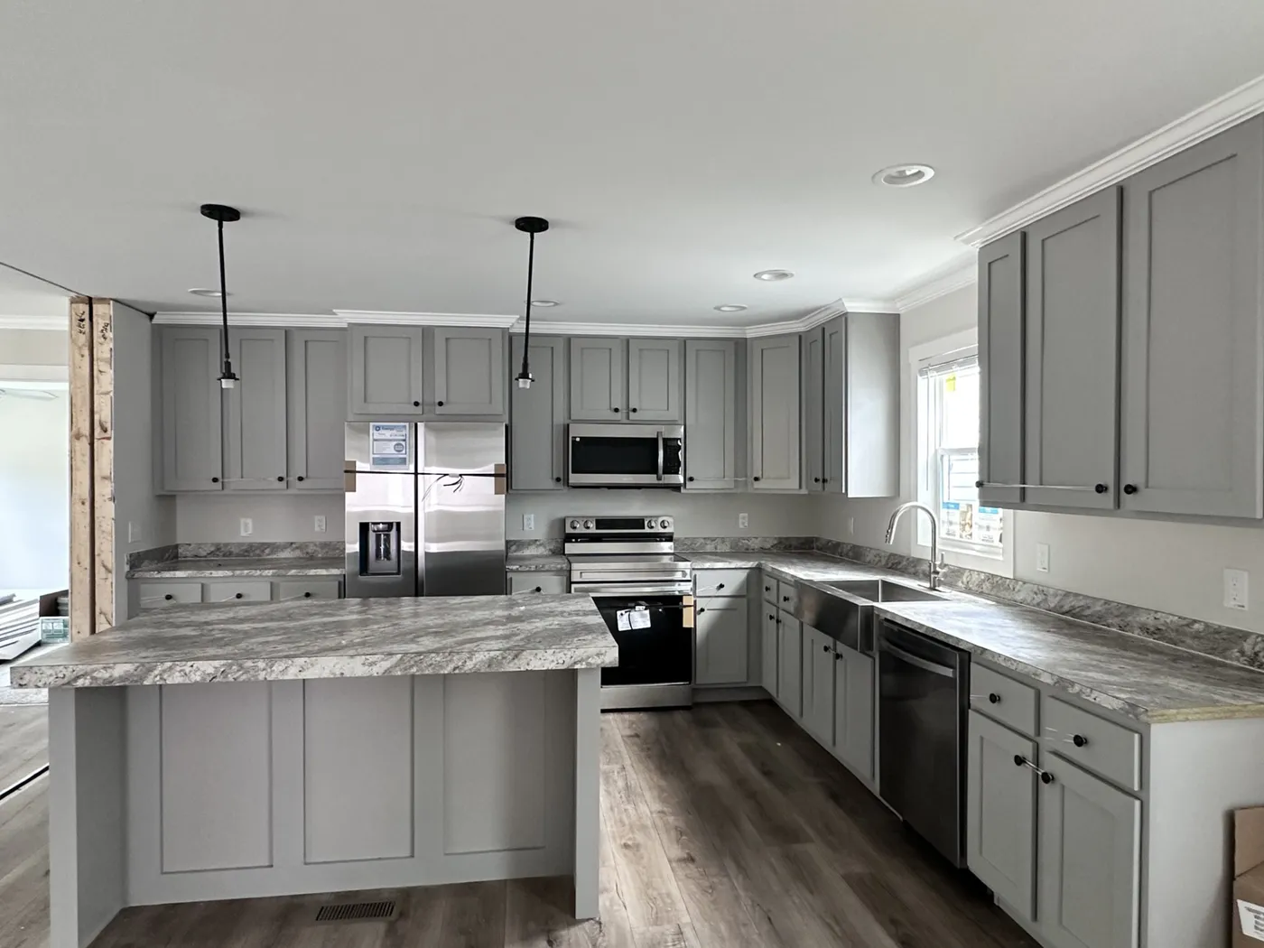 Modern style grey cabinets with black appliances!