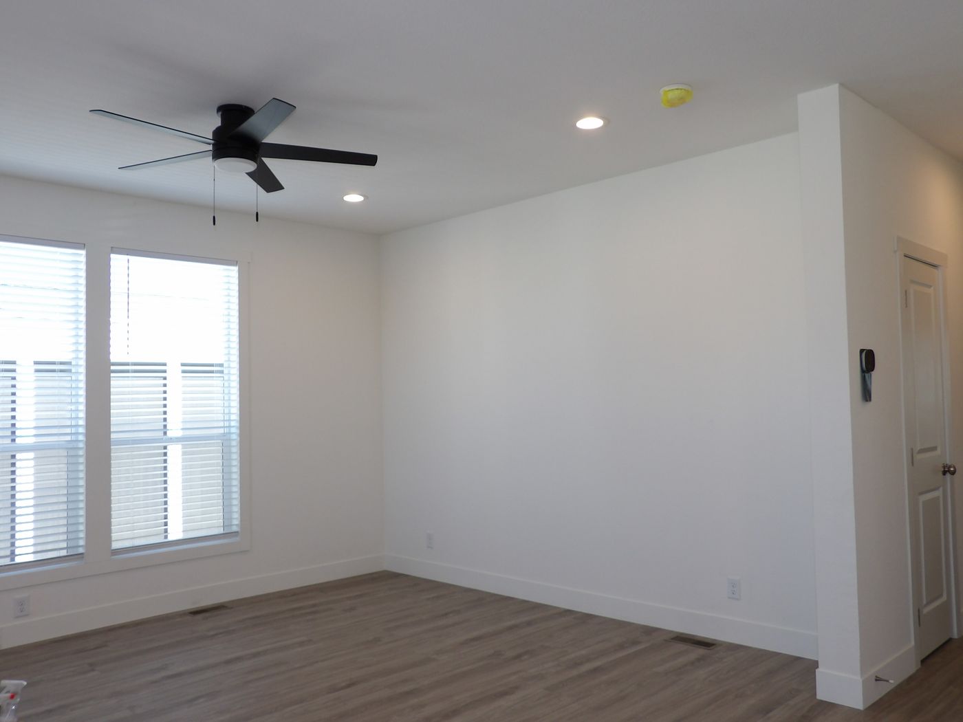 Living Room offers floor-to-ceiling Dual Pane Low-E Windows