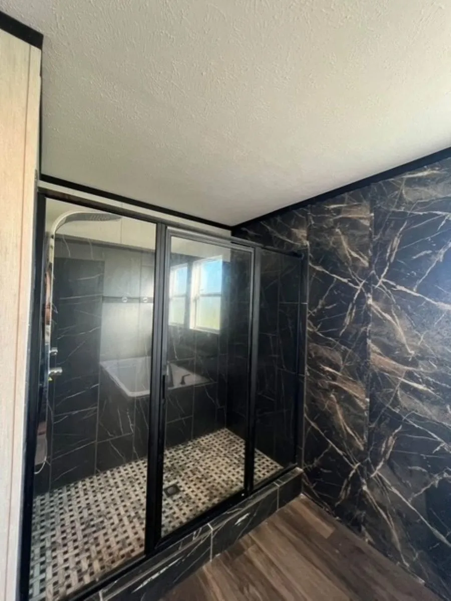 Tiled shower and floor in the shower this shower is a show stopper!