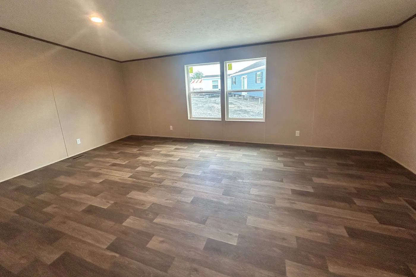 Another angle of the primary bedroom, standing in the entry way of the main bathroom. 