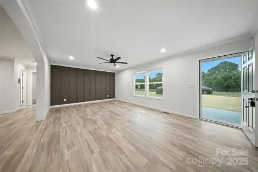 Spacious living room with custom feature wall.