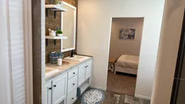 Dual porcelain sink vanity in the primary bathroom.